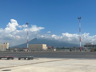 Sister of the bride on her way to Oregon from Italy… Mt Vesuvius waving goodbye from the tarmac!
