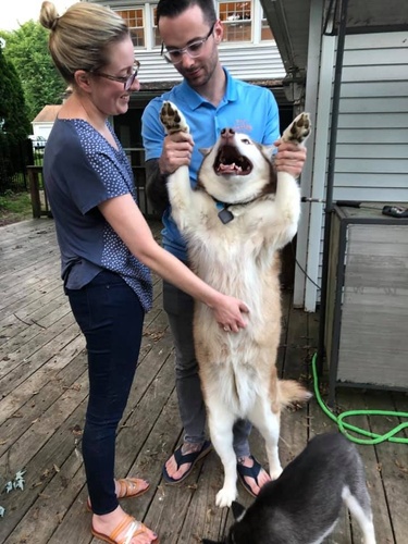 Ben and Alexis enjoying time with Tijs on the back porch. 2019