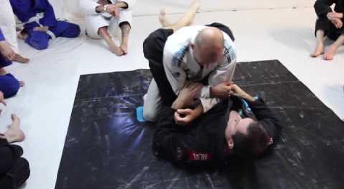BJJ lesson: Roger Gracie shows how to adjust the armbar from the closed guard