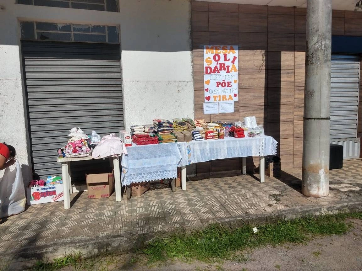 Donations on a table in the sun.