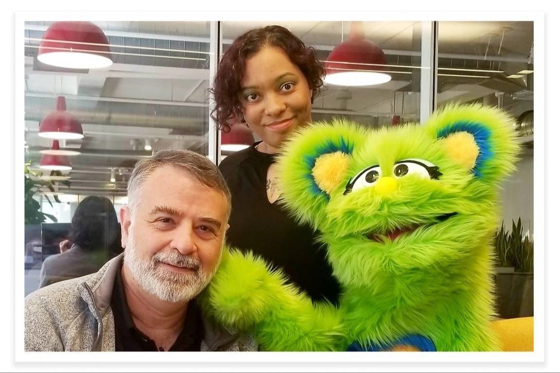 Sarah McKenzie, Ami Dar, and Ida the puppet pose for a photo together.