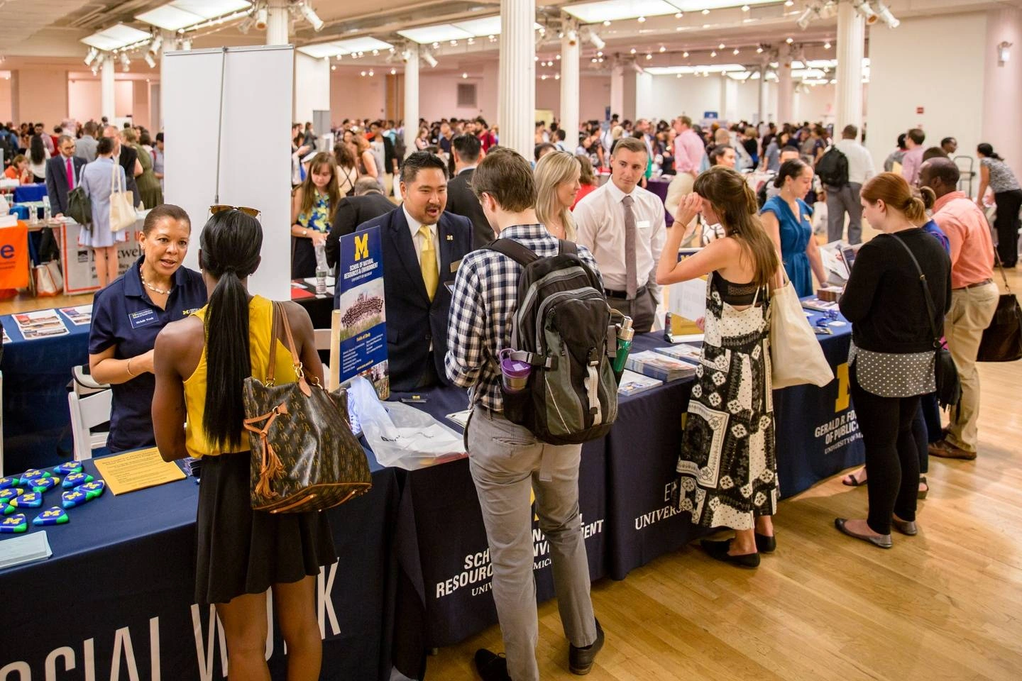 A photograph of students and graduate programs at the Idealist Grad School Fair in New York in 2019.