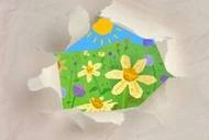 torn paper with flowers inside.