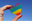 Mão feminina segura coração nas cores simbólicas LGBTQ