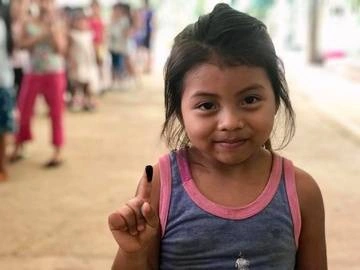 One of the kids from casa Guatemala showing her finger after internal elections
