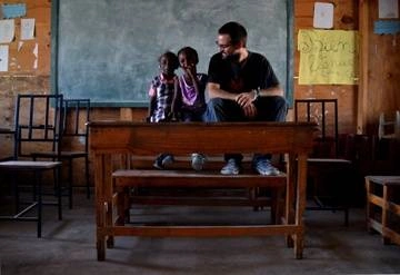 Professional volunteer with students in Haiti