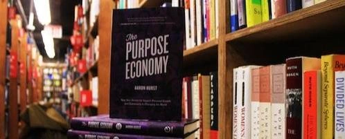 A shot of the book 'The Purpose Economy' in a library.