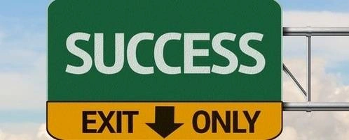 A road sign that says' Success'.