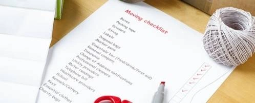 A moving checklist on a table.