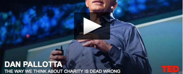 A screenshot of Dan Pallotta's TED Talk with a play button in the middle.