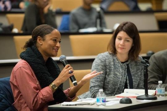 A Ford School graduate student asks questions of panelists at a Policy Talks event