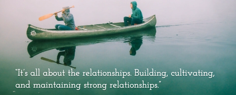 Two people pedaling in a canoe over a quote about relationships.