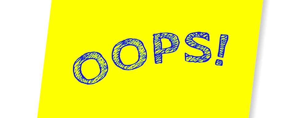 A post it with the words 'Oops'.