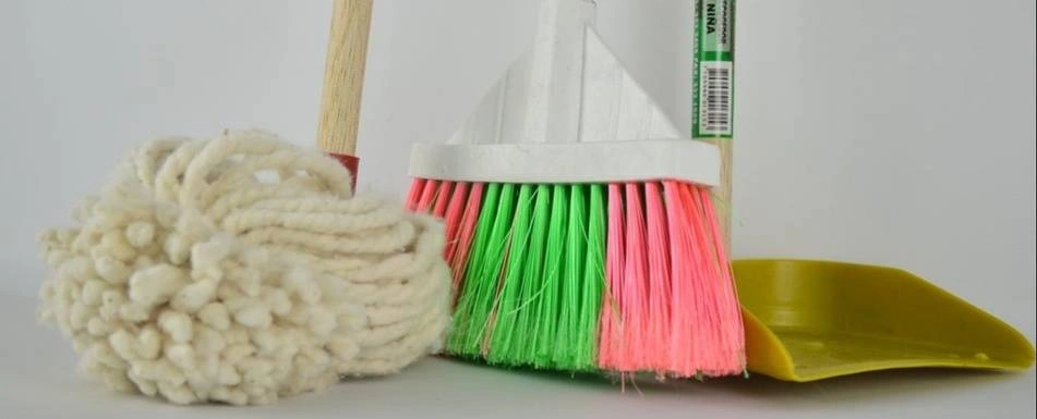 A mop, a broom and a dustpan.