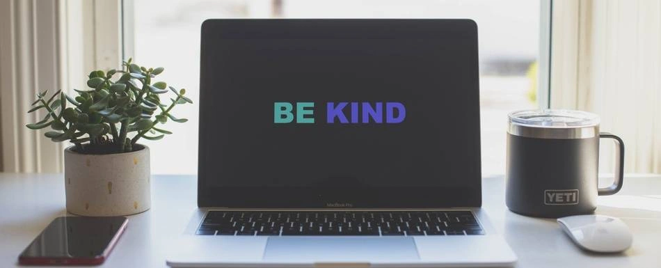 "Be Kind" written on a computer screen