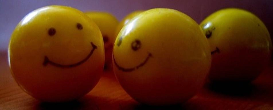 Yellow Balls with smiley faces in them.