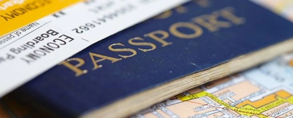 A passport with a ticket and a map.