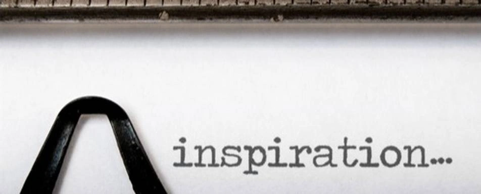 A typewriter with 'inspiration...' written on it.