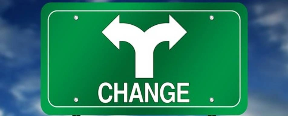 A sign that says, "Change", pointing in two directions.