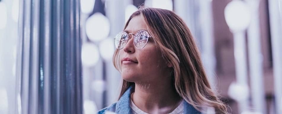 woman looking thoughtfully to the side