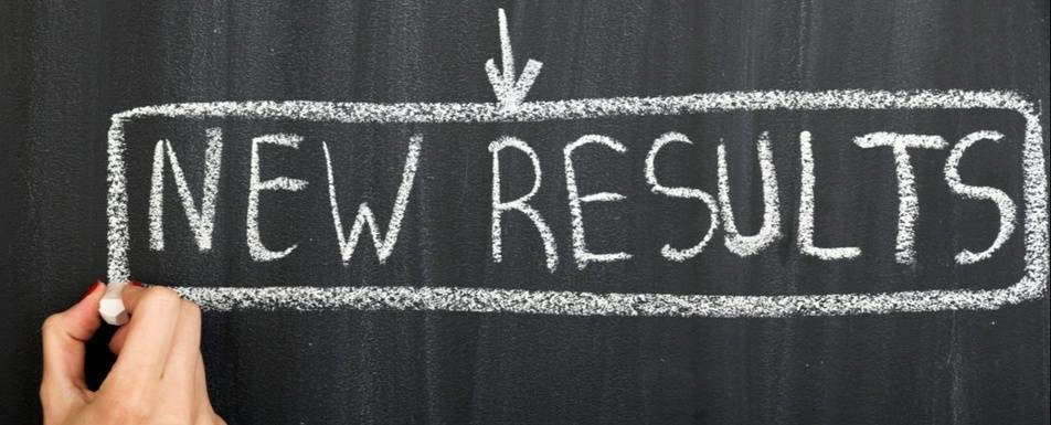 A chalkboard that says 'New Results.'