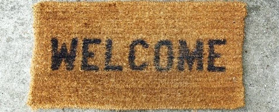Close up of a welcome mat.