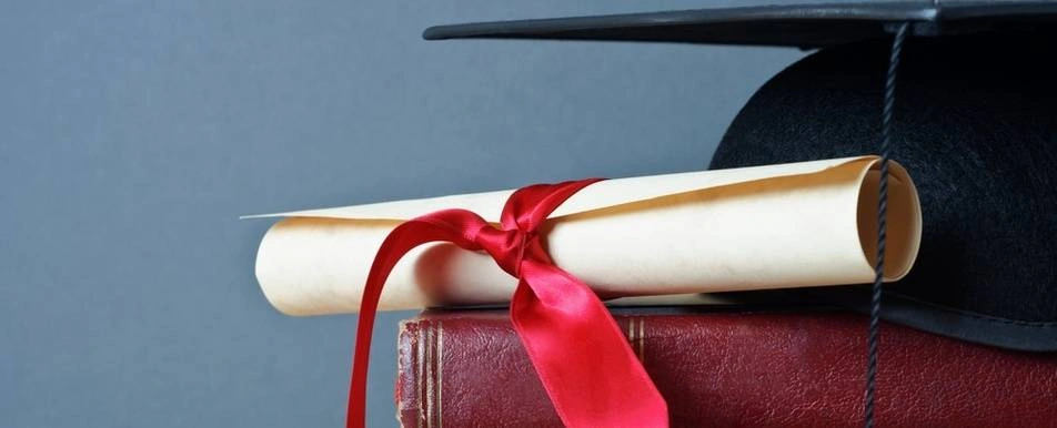 A close up of a rolled up diploma.