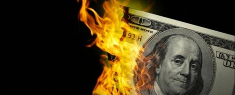 A $1000 bill on fire.