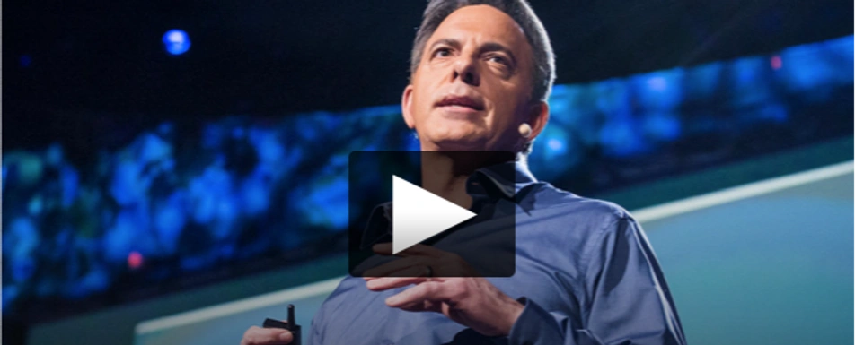 A screenshot of Dan Pallotta's TED Talk with a play button in the middle.