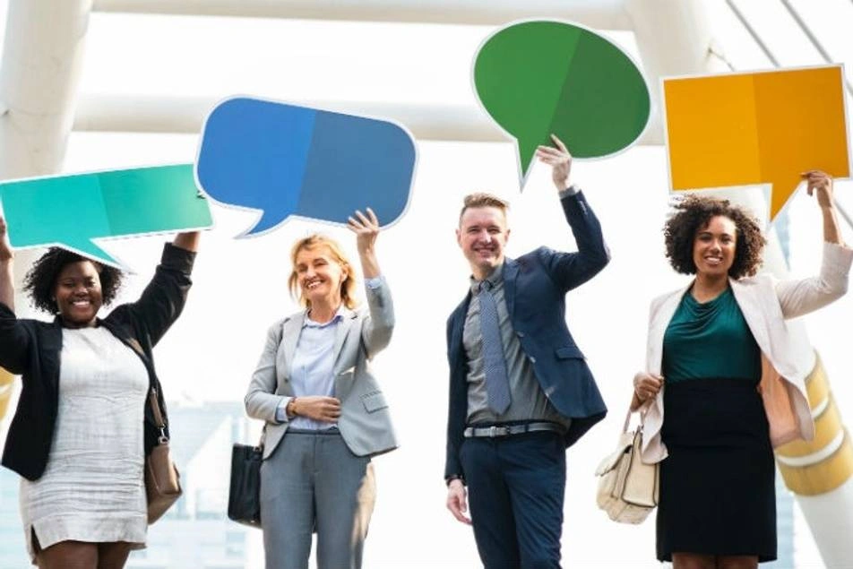 For young business professionals hold up speech bubbles.