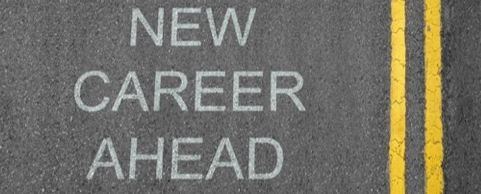 A road that says, "New Career Ahead" in chalk.